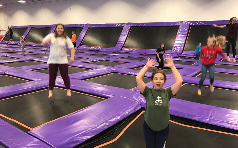 Centenary youth jumping on trampolines