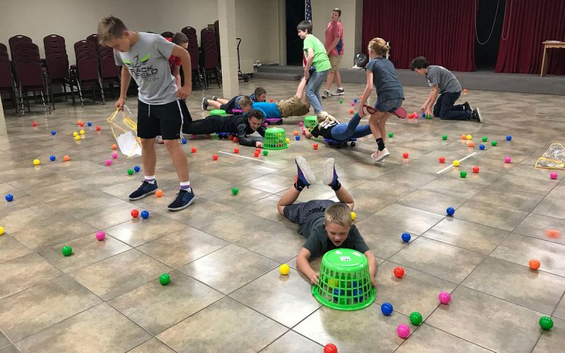 boys and girls playing hungry hippos in the Fellowship Hall