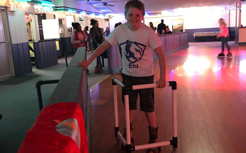 boy smiling while roller skating