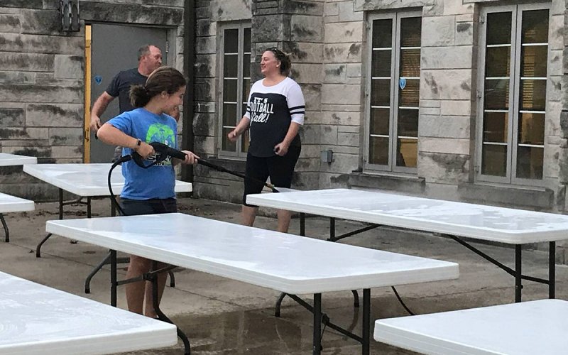 Centenary staff and youth washing tables