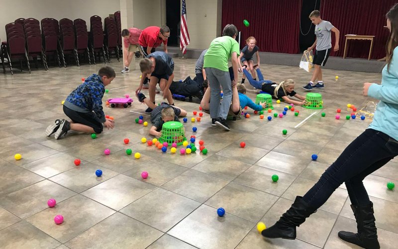 Centenary youth playing hungry hippos in the Fellowship Hall