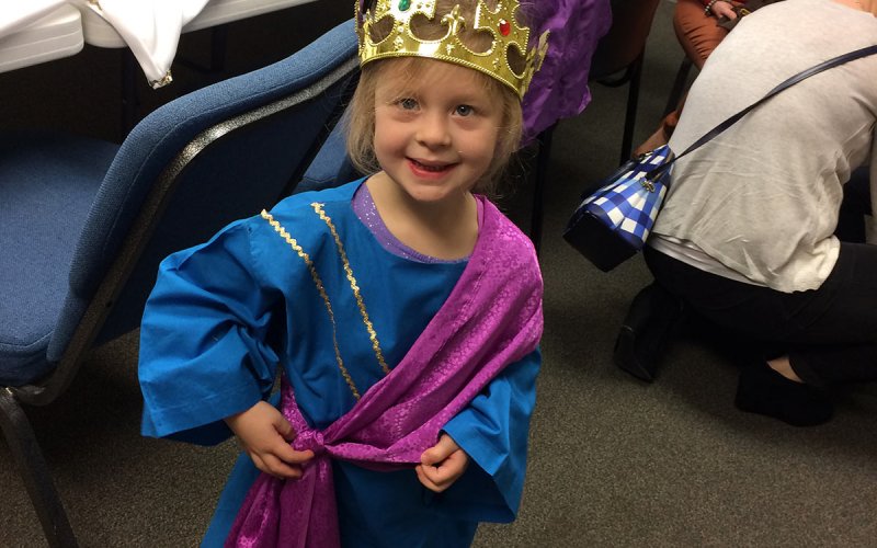 girl dressed as one of the three kings for Christmas